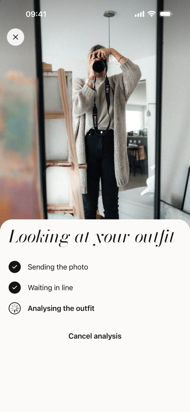 Duvion checking an outfit photo